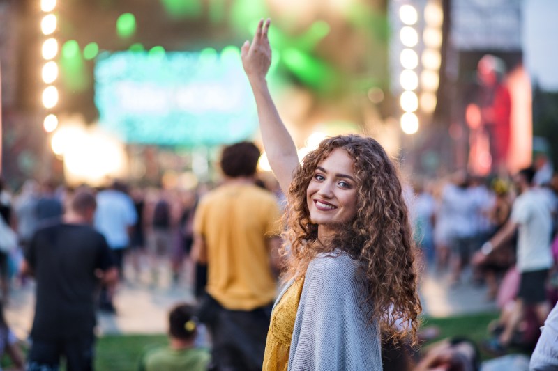 beautiful-young-woman-dancing-at-summer-festival